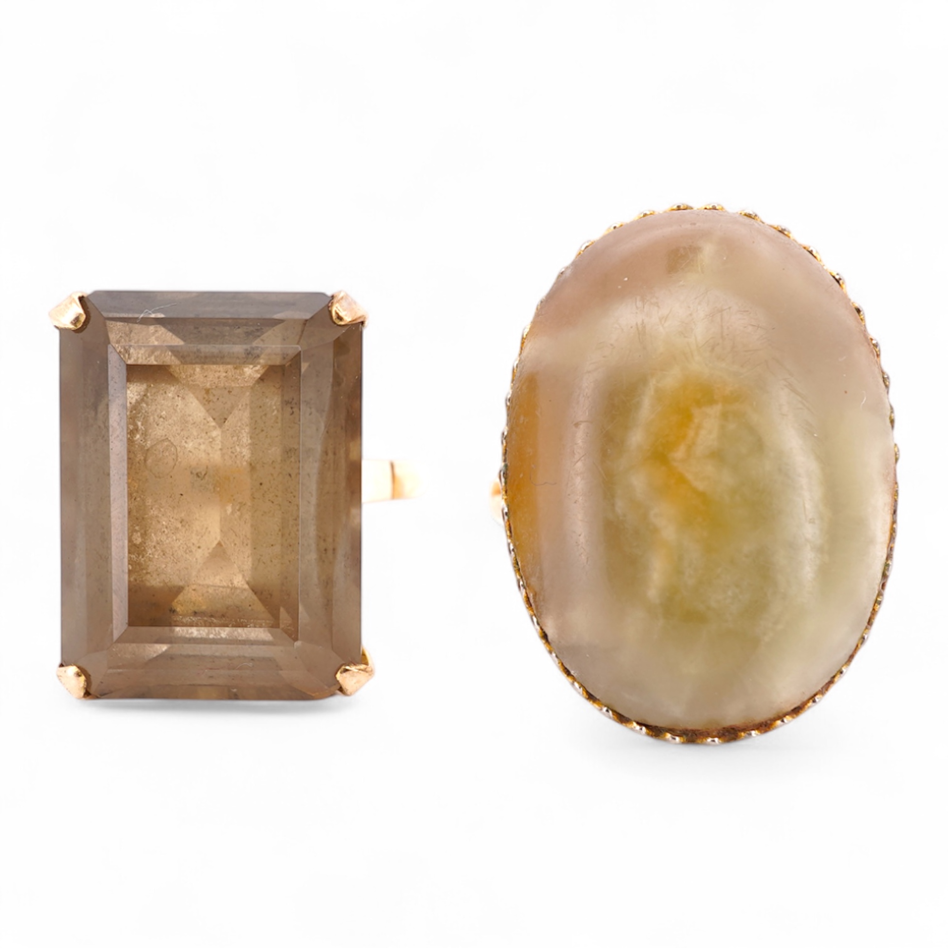 A modern 9ct gold and single stone emerald cut smoky quartz set ring, size N and one other 1960's 9ct gold shank, with a later added agate set white metal mount.